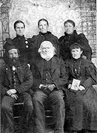 Dr. (Rev.) Daniel Willson in the front center, and his daughter directly behind him is Clarissa Jane (Clara Jane) Willson Blaisdell. Others are unknown, but thought to be his children.  Contributed by Sheilla Norton