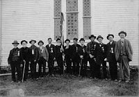 James Collett and Elijah Blaisdell Civil War Reunion (Rock Elm, WI). This is a picture taken in Rock Elm WI, during a reunion of the WI Infantry of the Civil War. I am unsure of the date, but know it to be around the turn of the century and before 1905 (when James Collett died). James and Elijah and the two elderly gentlemen in the center holding the flag.  Contributed by Sheilla Norton